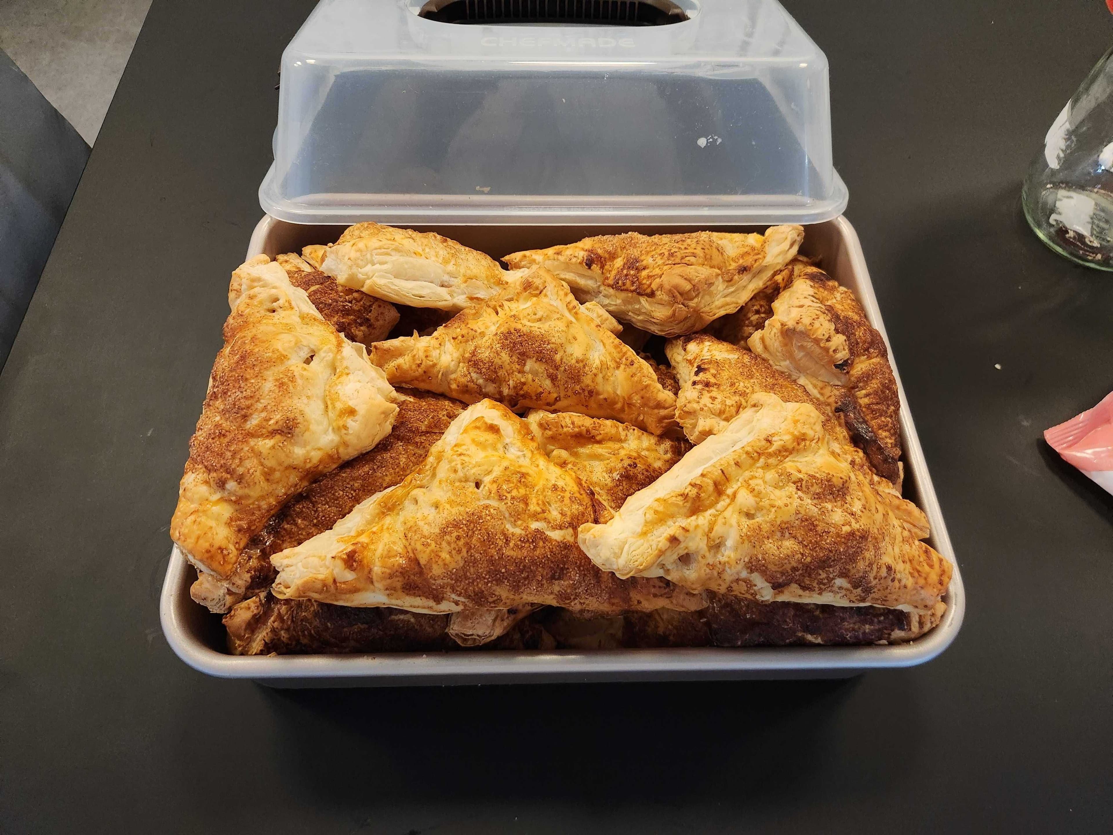 A tray of freshly baked appelflappen (Dutch apple turnovers)